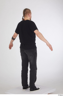 Sigvid a poses black jeans black sneakers black t shirt…